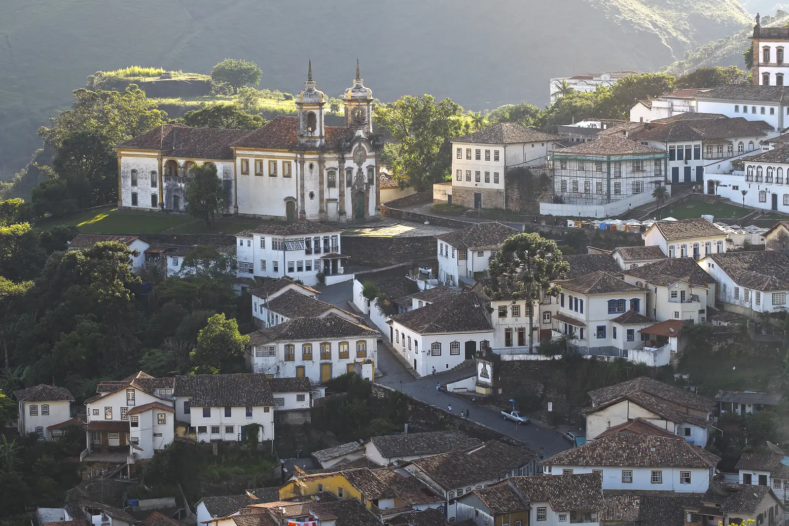 Baroque churches and whitewashed houses on the hills of Ouro Preto, Minas Gerais, Brazil.